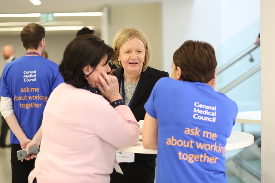GMC employees talking together at an event