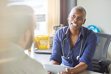 A doctor talking to a patient
