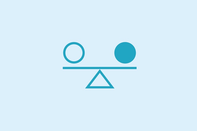 An icon featuring shapes on a scale