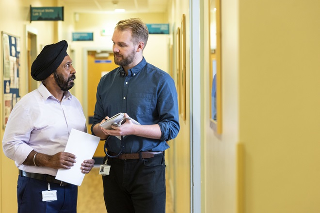 Two men in discussion in a medical discussion
