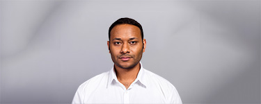 A man wearing a white button-up shirt.