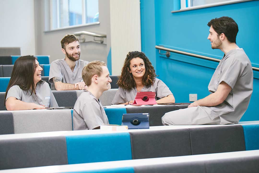 Students sitting together in a lecture theatre