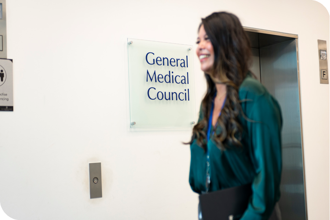 A woman walks down a GMC corridor