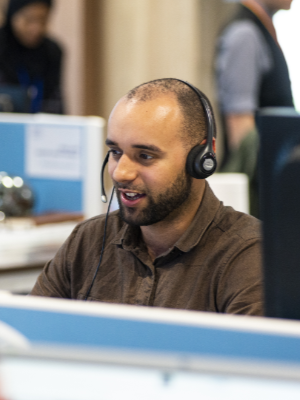 A member of staff on a call in the Manchester office
