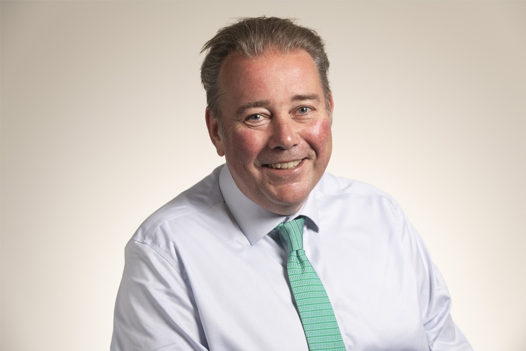 Headshot of Charlie Massey, Chief Executive of the GMC, wearing shirt and tie