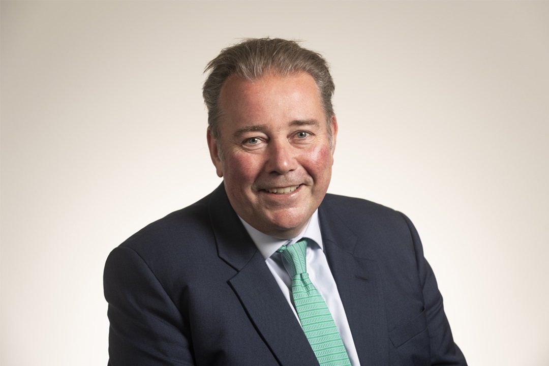 Headshot of Charlie Massey, Chief Executive of the GMC, wearing shirt, tie and jacket.