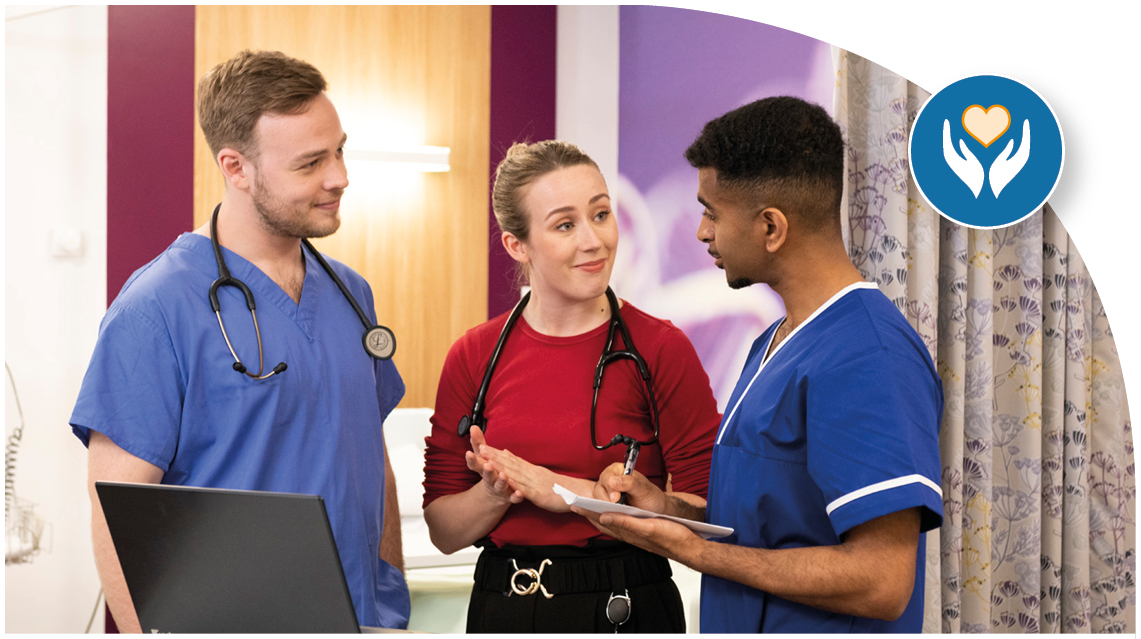 Three medical professionals stood in coversation.