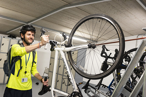 A colleague putting his bike into our storage facilities